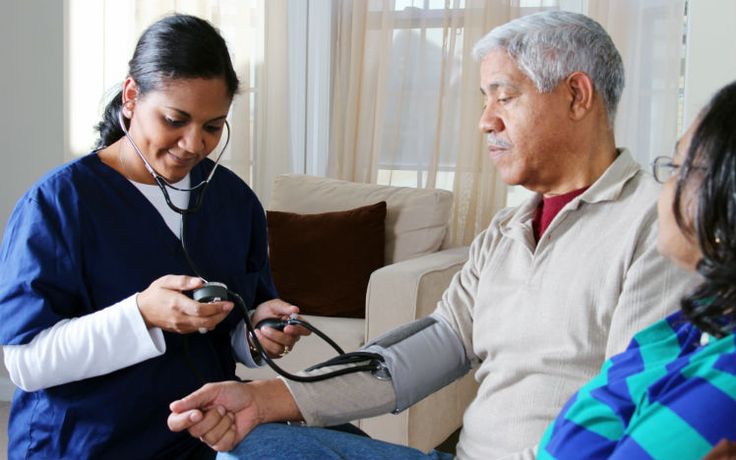 Healthcare provider visiting a patient at home
